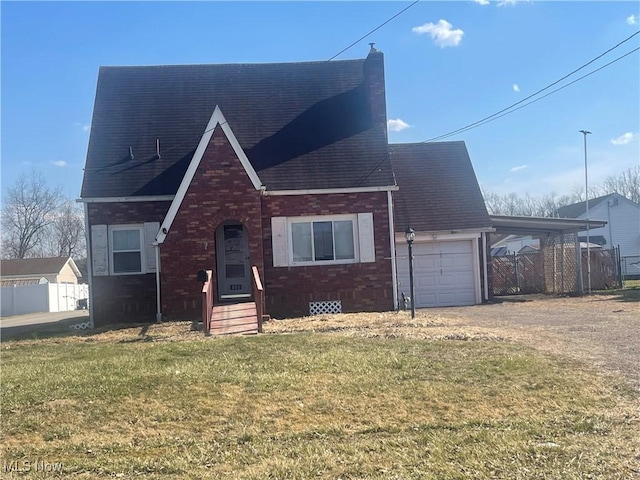 view of front of house featuring a chimney, a front lawn, a garage, dirt driveway, and brick siding