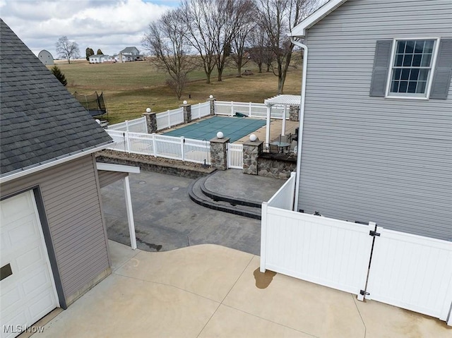 view of patio featuring a fenced in pool and a fenced backyard