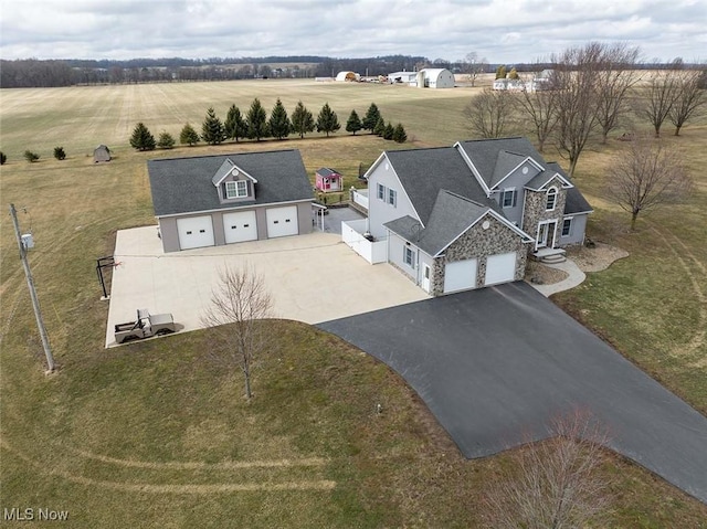 birds eye view of property featuring a rural view