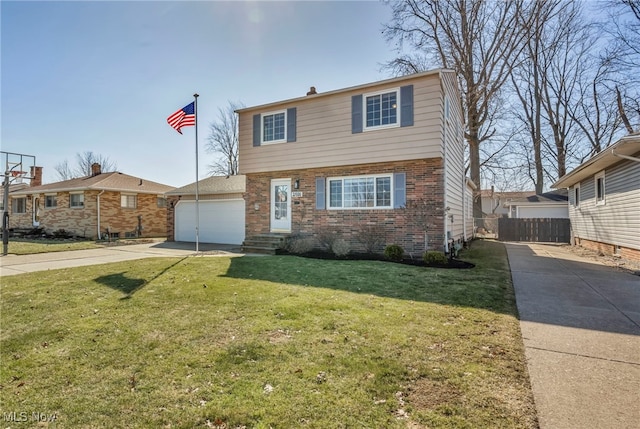 colonial house with a front yard, brick siding, and driveway