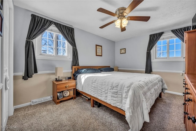 bedroom with visible vents, multiple windows, baseboards, and carpet floors