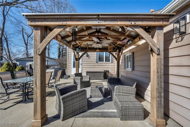 view of patio / terrace featuring a ceiling fan, a gazebo, grilling area, outdoor lounge area, and outdoor dining area