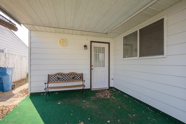 doorway to property with fence