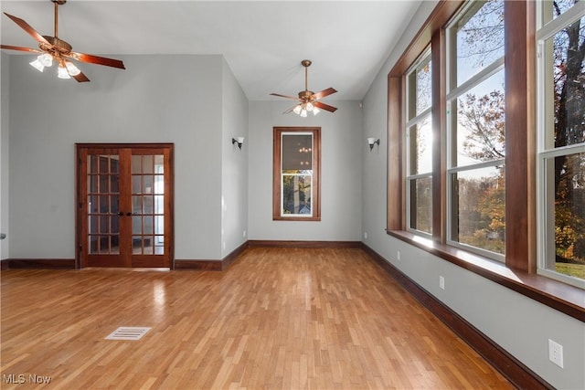 unfurnished room with baseboards, visible vents, and light wood-type flooring