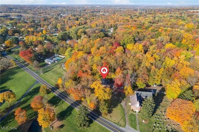 drone / aerial view featuring a forest view