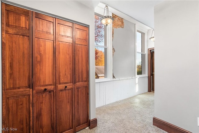 hallway with carpet flooring