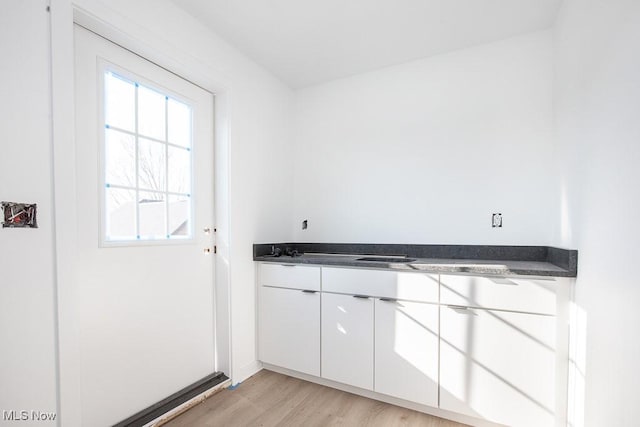 doorway to outside featuring light wood-style flooring