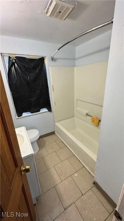 bathroom with visible vents, baseboards, toilet, bathtub / shower combination, and vanity