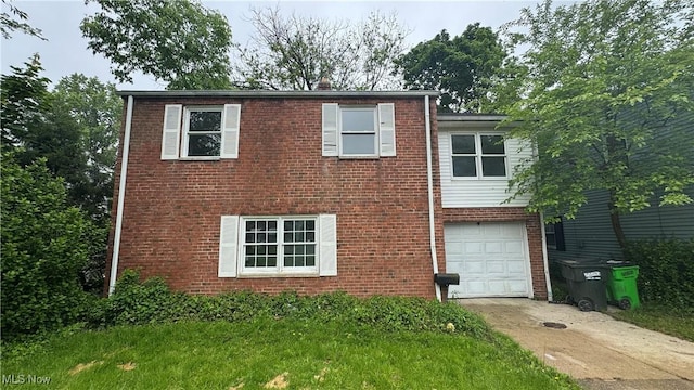 20900 Priday Ave, Euclid, OH 44123 - view of front of property with driveway, brick siding, and an attached garage