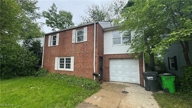 20900 Priday Ave, Euclid, OH 44123 - view of front of house featuring brick siding, a garage, driveway, and a front yard