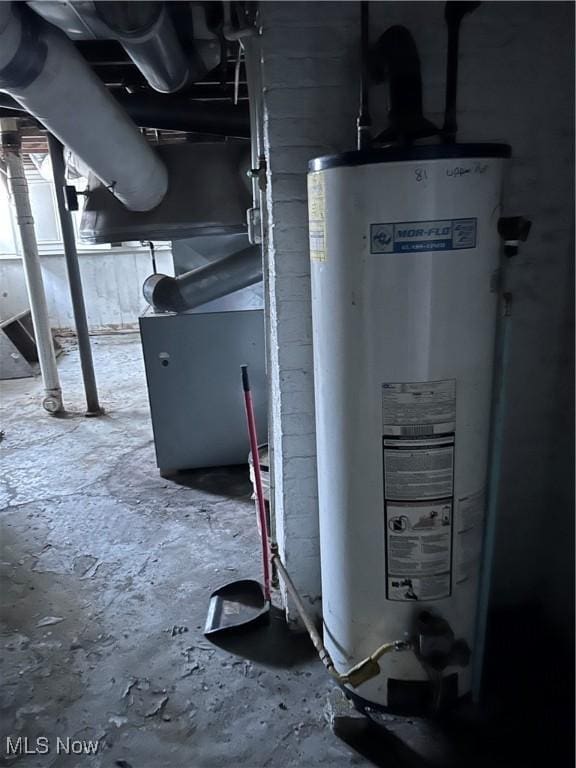 utility room featuring water heater