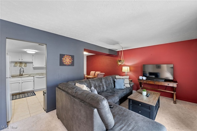 living room with light tile patterned floors, light carpet, and a textured ceiling