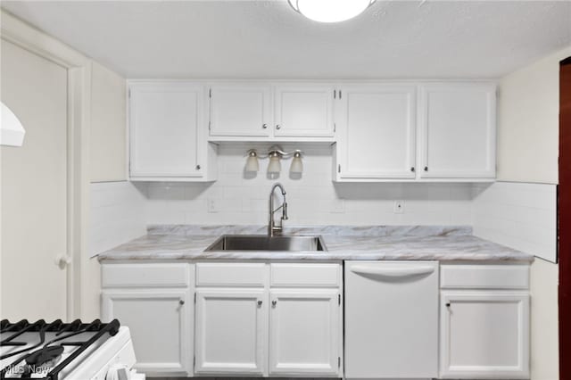 kitchen with white cabinetry, white appliances, decorative backsplash, and a sink