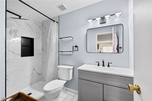 full bathroom with visible vents, toilet, marble finish floor, a marble finish shower, and vanity