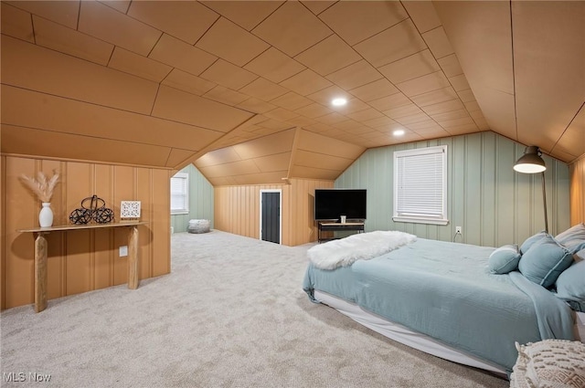 carpeted bedroom with vaulted ceiling