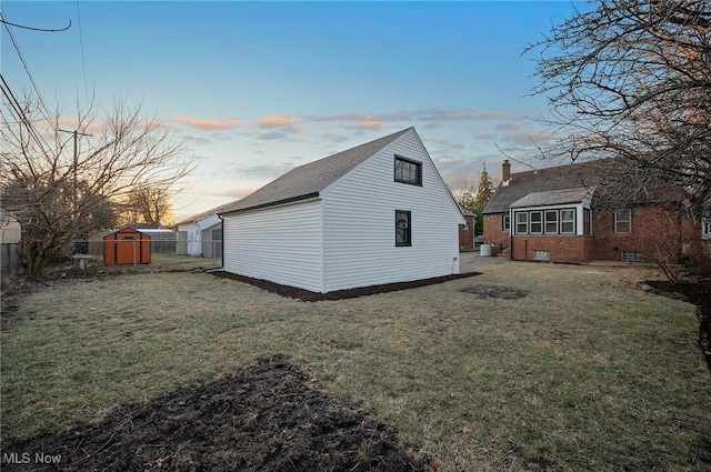 exterior space featuring an outbuilding and fence