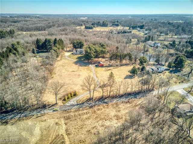 birds eye view of property with a rural view