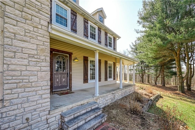 property entrance featuring covered porch