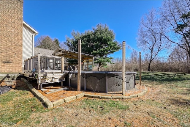 view of yard featuring a wooden deck