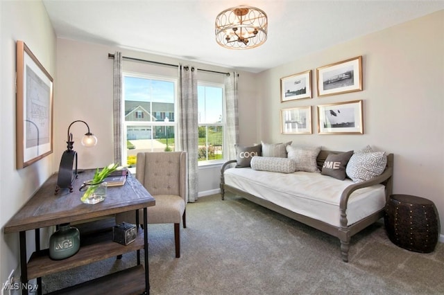 sitting room featuring a notable chandelier, carpet flooring, and baseboards