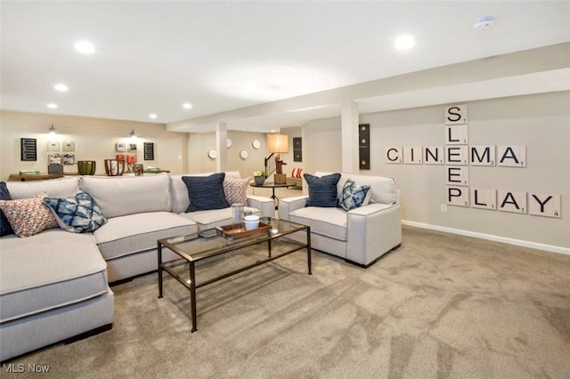 carpeted living area featuring recessed lighting and baseboards