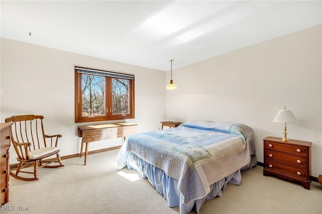 carpeted bedroom with baseboards