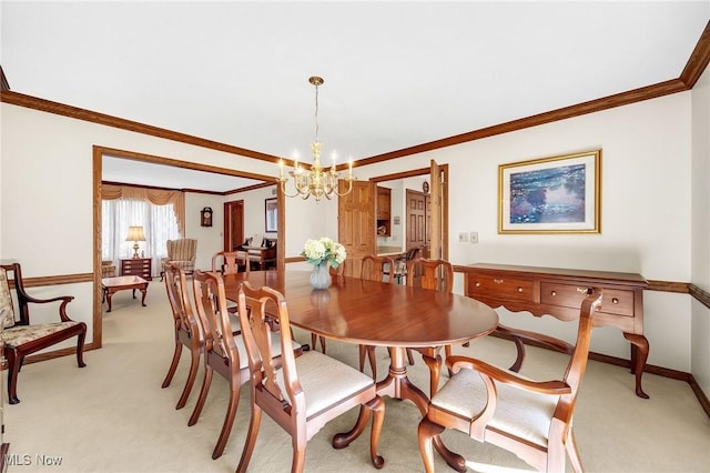 dining area featuring baseboards, light carpet, an inviting chandelier, and crown molding