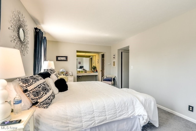 bedroom featuring baseboards and carpet floors