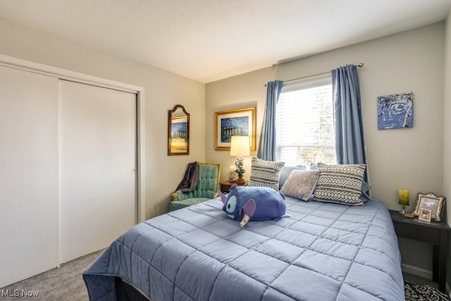 carpeted bedroom with a closet