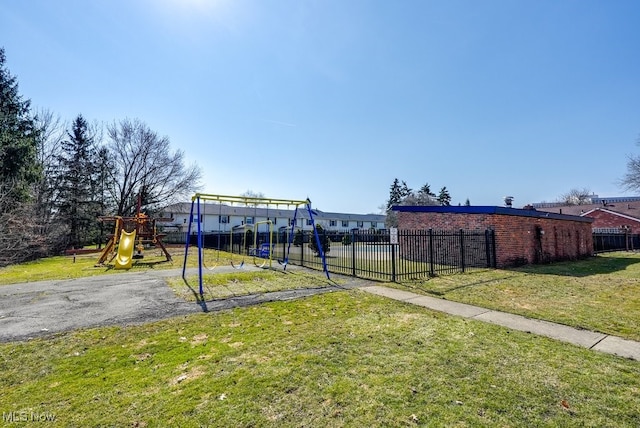 exterior space with playground community and fence