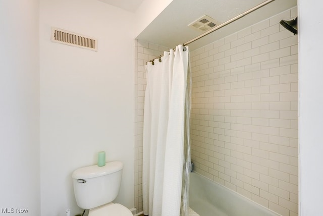 full bath with visible vents, toilet, and shower / bath combo