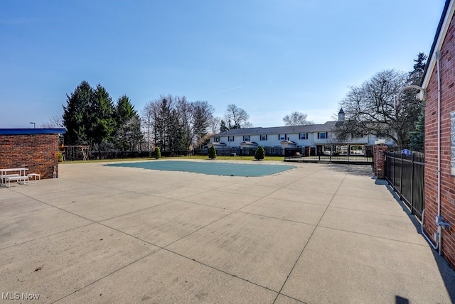 view of swimming pool with a patio area and fence