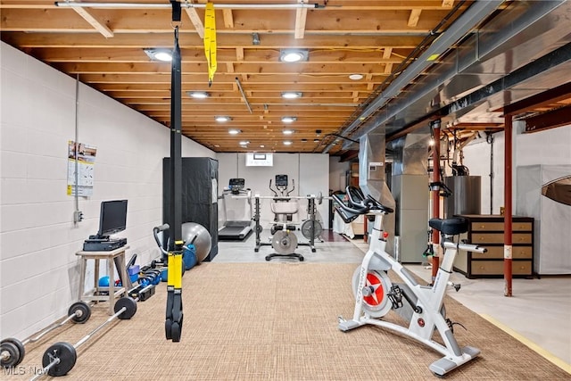 exercise area with concrete block wall