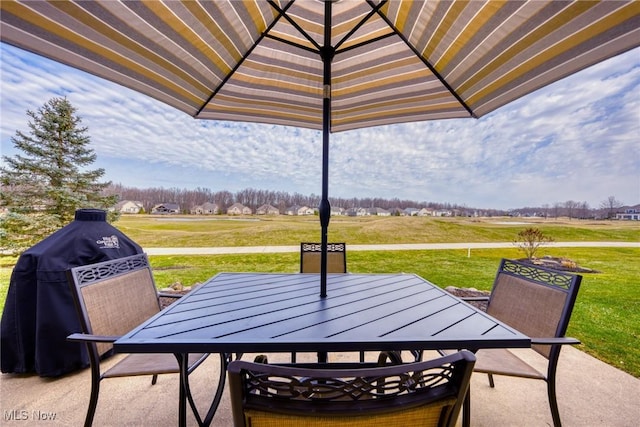 view of patio featuring area for grilling and outdoor dining space