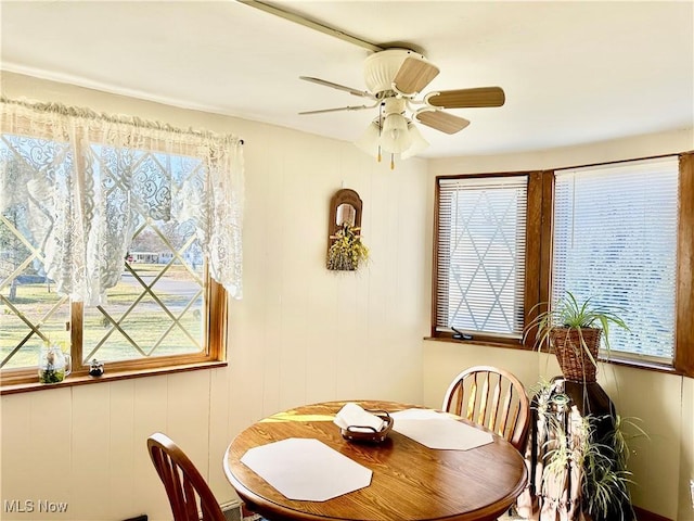 dining space featuring a ceiling fan