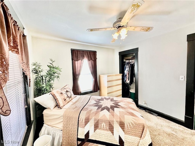 bedroom with a closet, baseboards, ceiling fan, and carpet floors