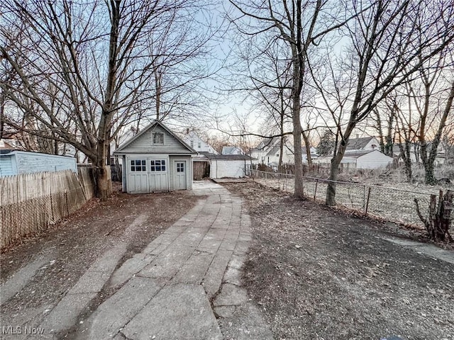 view of yard featuring an outbuilding and a fenced backyard