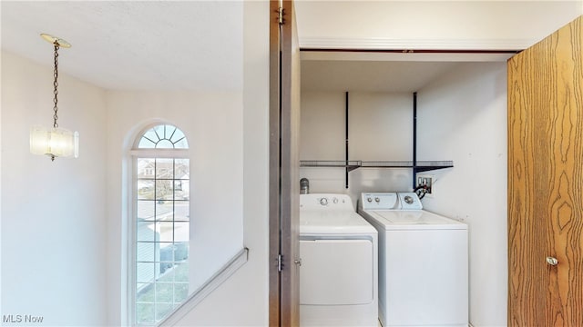 washroom with washer and clothes dryer and laundry area