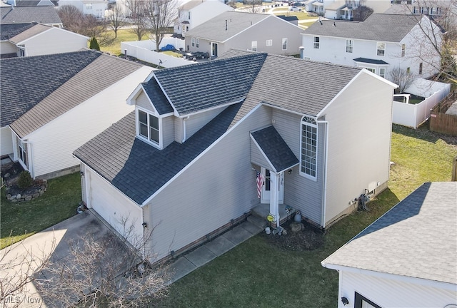 birds eye view of property with a residential view