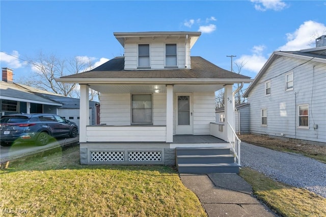 bungalow-style home featuring a porch, a front yard, and a shingled roof