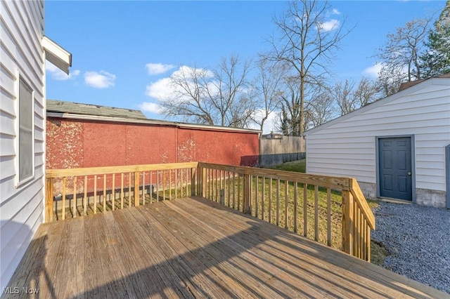 wooden terrace featuring fence