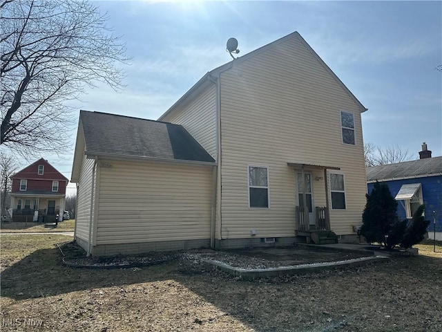 rear view of house featuring entry steps