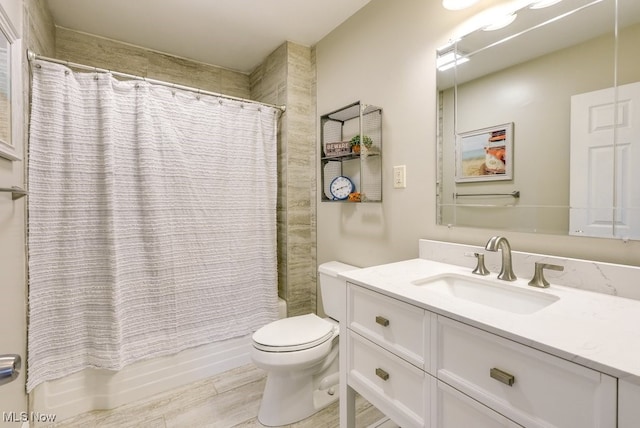 full bathroom featuring vanity, toilet, shower / bath combo with shower curtain, and wood finished floors