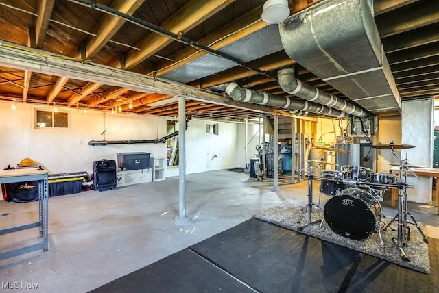 unfinished basement featuring stairway