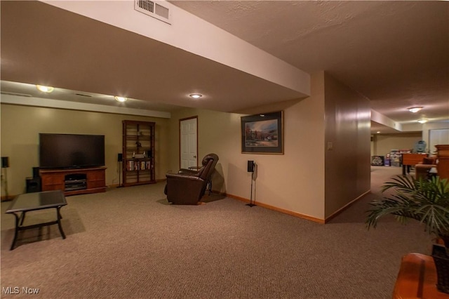 living room with visible vents, baseboards, and carpet floors