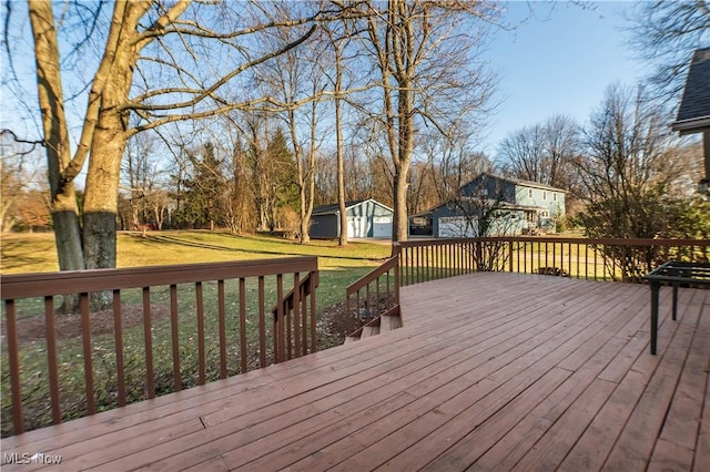 deck with an outbuilding and a yard