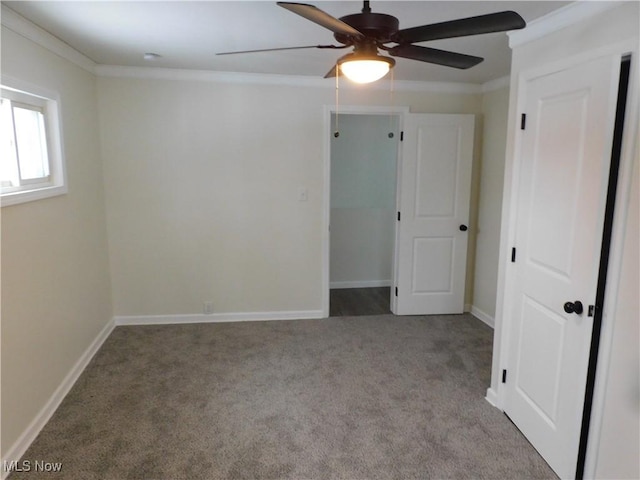 unfurnished bedroom with ceiling fan, baseboards, carpet, and ornamental molding