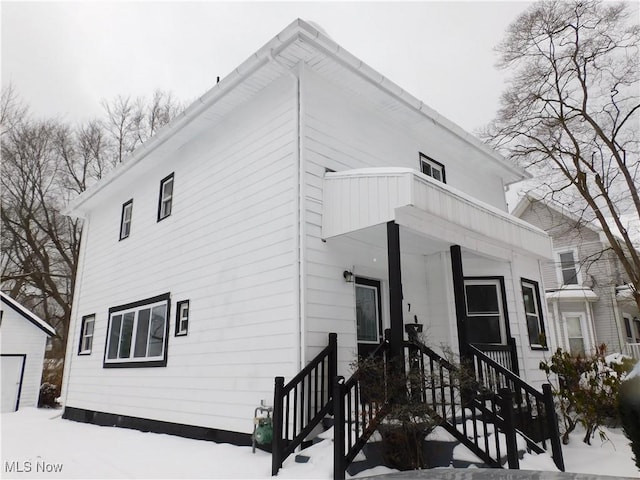 rear view of property with a balcony