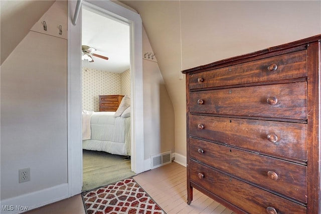 interior space featuring visible vents, baseboards, and wallpapered walls