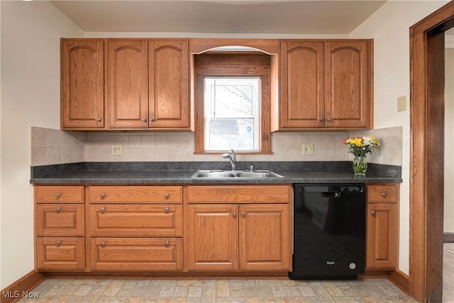 kitchen with a sink, decorative backsplash, black dishwasher, and dark countertops